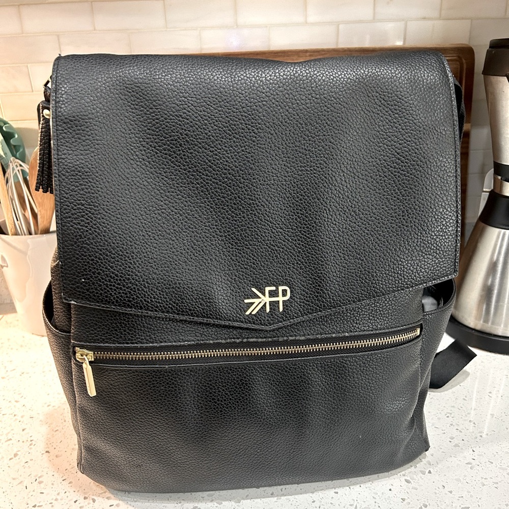 Freshly picked black leather diaper bag